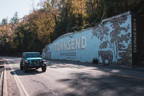 A Jeep drives by the Townsend, Tennessee, sign.