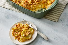 Southern Living Old School Squash Casserole with a serving scooped out onto a plate with a fork