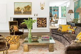 Rancher Living Room with Brown Sofa with Wood Storage next to Fireplace