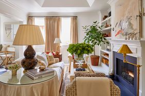 Neutral living room with layers of patterns and textures centered around fireplace