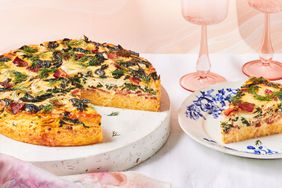 Swiss Chard-and-Bacon Grits Quiche prepared and on a platter to serve