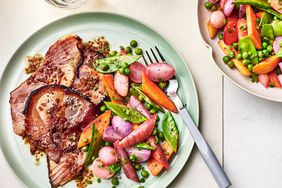 Southern Living Glazed Ham Steaks on a plate to serve with spring vegetables