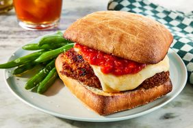 Chicken Parmesan Sandwich on a plate with green beans - Southern Living