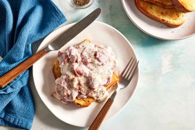 creamed chipped beef on toast with knife and fork on plate