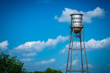 Round Rock water tower in front of a blue sky