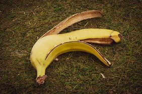 Banana peel on the green grass