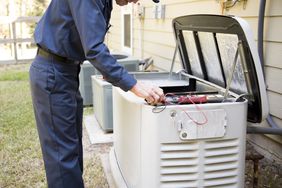 technician installing power generator