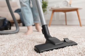 Vacuuming carpet