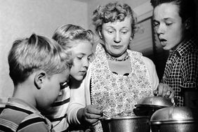 Black and white photo of family cooking