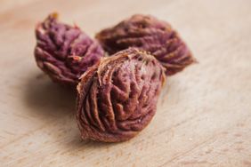 tree peach seeds on a wooden cutting board