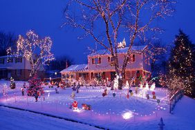 Christmas lights on a house in the snow