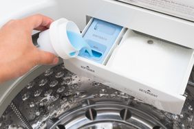 putting fabric softner into washing machine