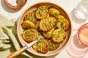 Southern Living Grilled Potatoes in a bowl to serve, garnished with parsley