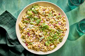 Southern Living Macaroni Salad in a bowl to serve topped with scallions