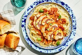 Southern Living Marry Me Chicken Roll Ups on a plate to serve with spaghetti