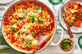 Southern Living Ravioli Lasagna in the pan with a serving on a plate