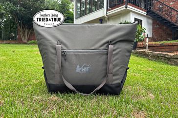 The REI Co-Op Pack-Away 24 Soft Cooler outside in grass