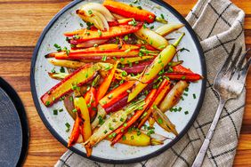 Southern Living Glazed Carrots on a serving platter with a serving fork beside