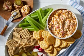 Southern Living Southern Pimento Cheese on a platter ready to serve with crackers and vegetables 