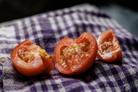 Tomato with seeds on a dishcloth