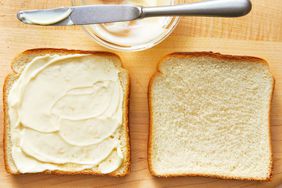 mayonnaise spread on a slice of bread